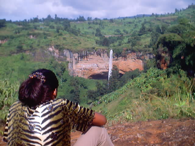 Joanitha viewing Sipi Falls, Mount Elgon, Uganda, 2003