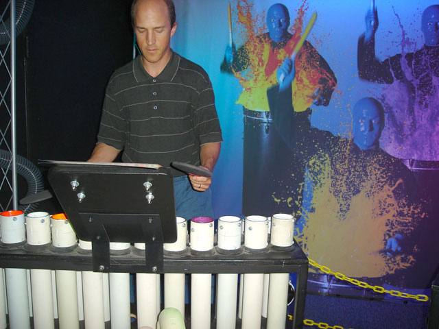 Greg playing pipes with blue men, Children's Museum, Denver, Colorado, 2007