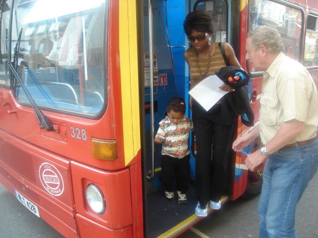 Joanitha and Joachim getting off a bus with Michael Hodd, Windsor, UK, 2008