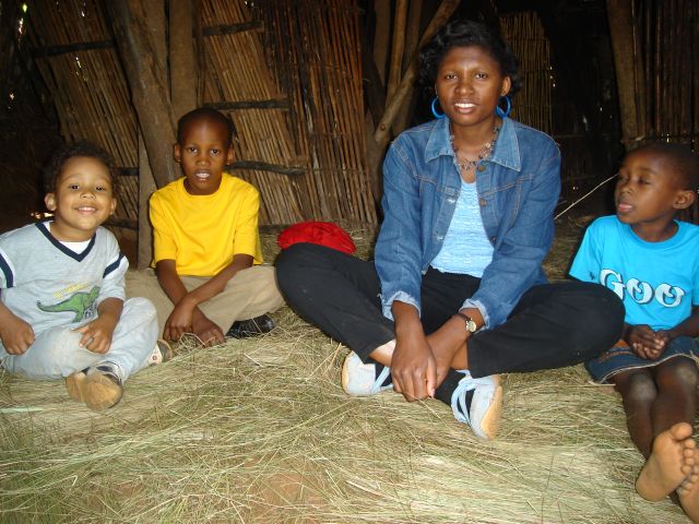 Joachim, Deo, Joanitha and girl in a traditional hut, "Kanazi, Kagera", Tanzania, 2008