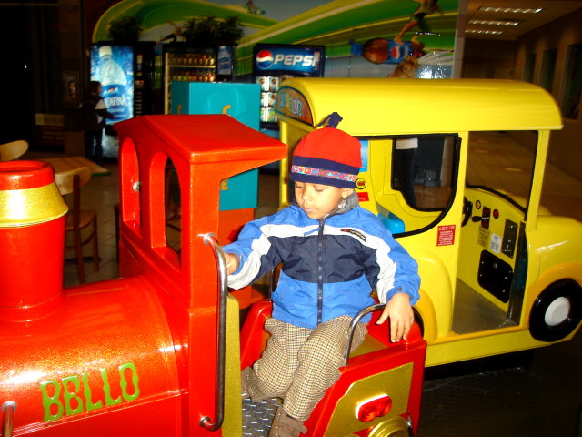Joachim on kiddie rides at the mall, Fort Collins, Colorado, 2008