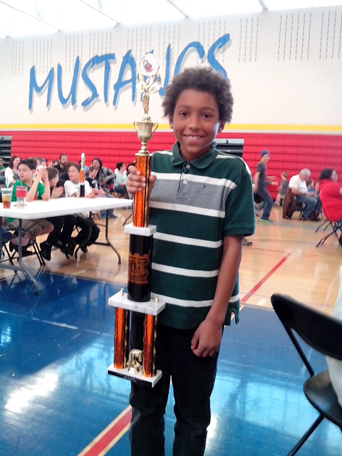 Joachim with his first place chess trophy, Fort Collins, Colorado, 2015