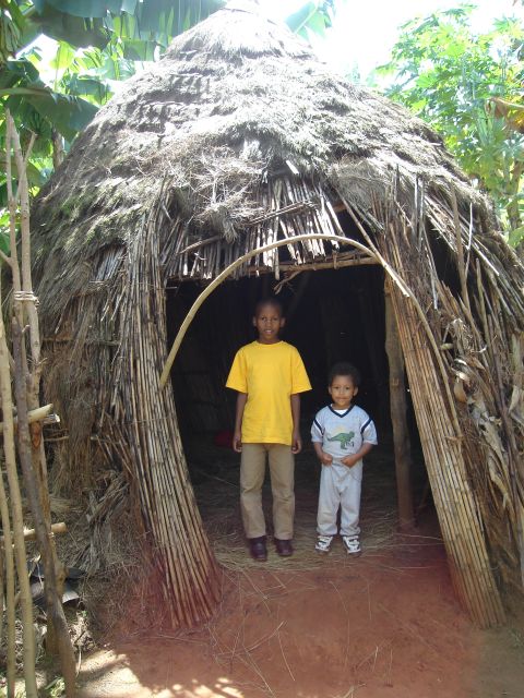 Joachim and cousin Deo in a traditional hut, "Kanazi, Kagera", Tanzania, 2008