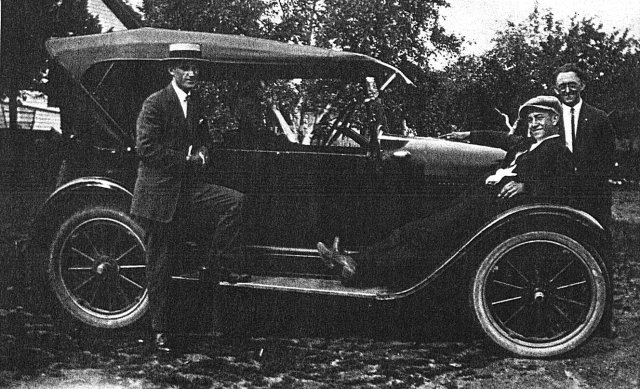 Michael Vogl with old car, Milwaukee, Wisconsin, 1930?