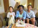 Irene, Joanitha and Joachim with birthday cake, Fort Collins, Colorado, 2018