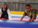 Joachim and Latifah in a bouncy castle, Fort Collins, Colorado, 2009