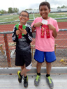 Joachim and Tariq with track meet ribbons, Fort Collins, Colorado, 2015